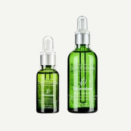 Desembre aging science facial restoring concentrate serum in a green bottle with dropper